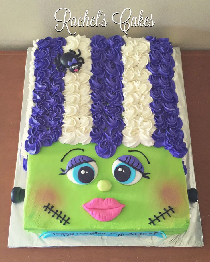 a cake decorated with purple and green icing