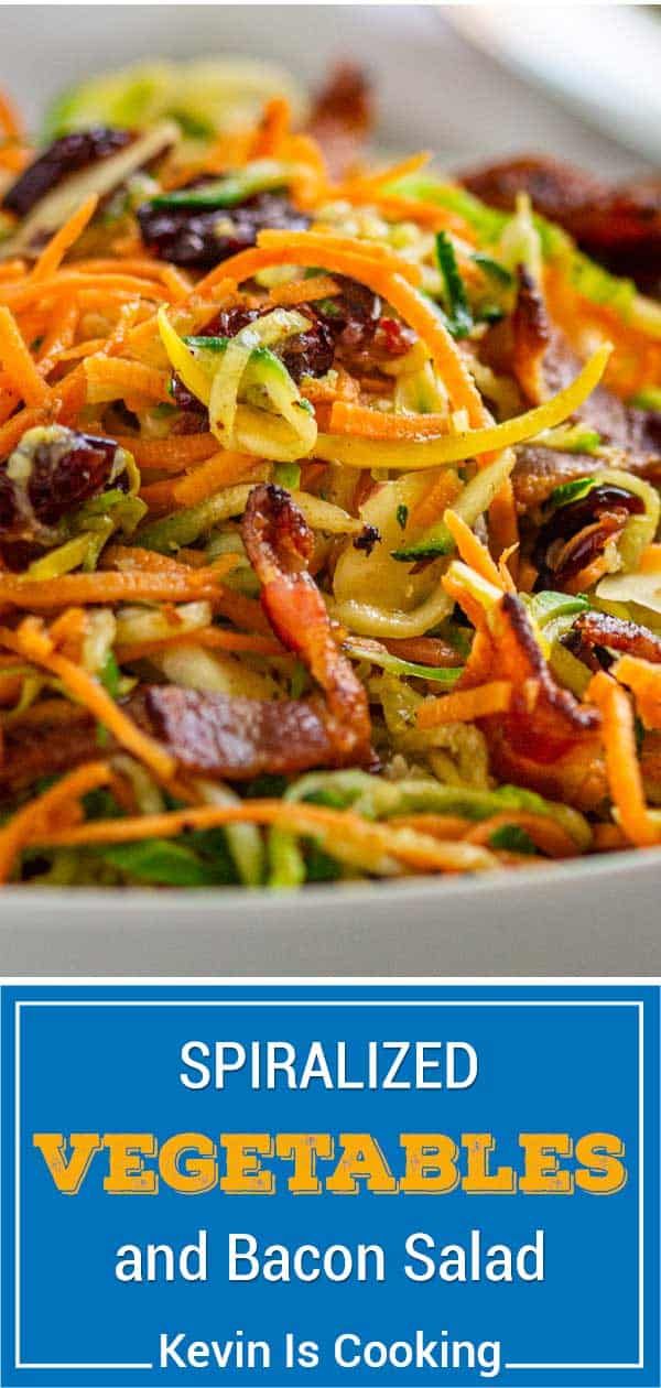 spiralized vegetables and bacon salad served in a white bowl with blue text overlay