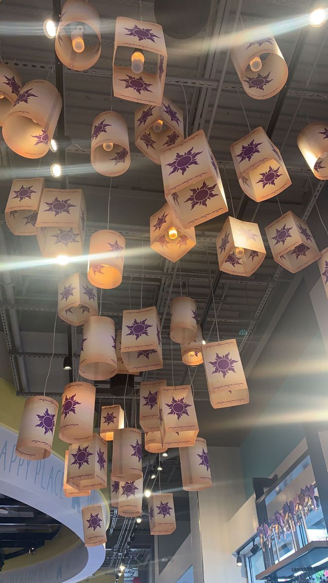 many paper lanterns are hanging from the ceiling