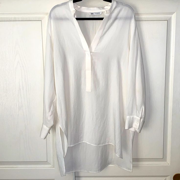 Cute Mandarin Collar Tunic Top. V-Neck And One Button. Length In The Front Is 32 1/2” Length In The Back Is 35”.,P-P 46”, Sleeves 22 1/4” Long. Polyester/Llyocell, Machine Washable. Nwot White V-neck Blouse For Layering, Chic V-neck Tunic For Spring, Casual V-neck Tunic For Brunch, Casual V-neck Tunic For Layering, Chic Split Neck Blouse For Daywear, V-neck Blouse For Layering, Chic V-neck Blouse For Layering, Chic V-neck Tunic For Workwear, Chic V-neck Blouse For Daywear