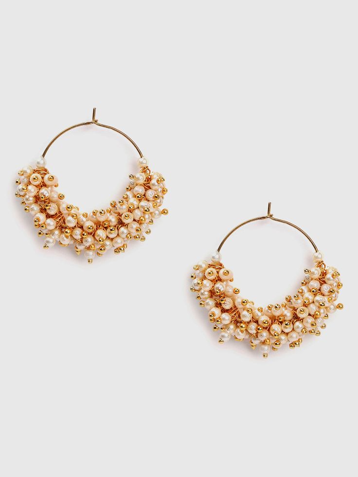 Drop earrings look super elegant and are a must-have in your jewellery collection. Irrespective of the fact whether they are long or short, they look completely gorgeous Trendy Gold Plated Earrings For Party, Trendy Gold Plated Party Earrings, Elegant Metal Chandbali Bridal Earrings, Trendy Plated Hoop Earrings For Party, Elegant Pearl Drop Hoop Earrings For Festive Occasions, Elegant Chandbali Bridal Earrings In Metal, Metal Earrings With Plating For Party, Gold Plated Single Earring For Festive Occasion, Elegant Metal Chandbali Chandelier Earrings