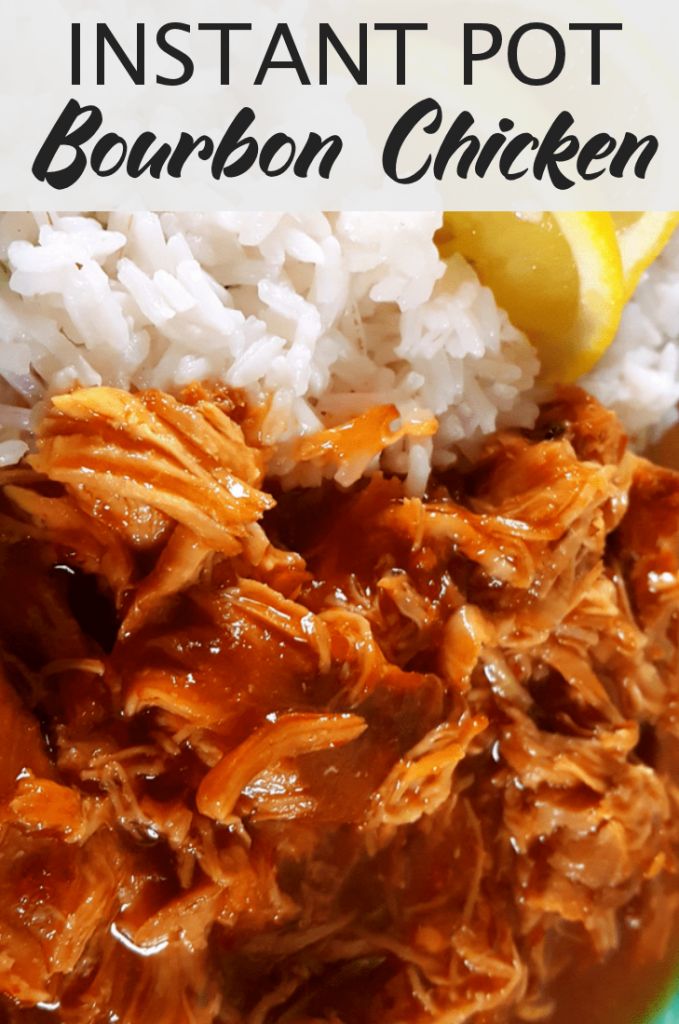 the instant pot bourbon chicken is ready to be eaten with rice and lemon wedges