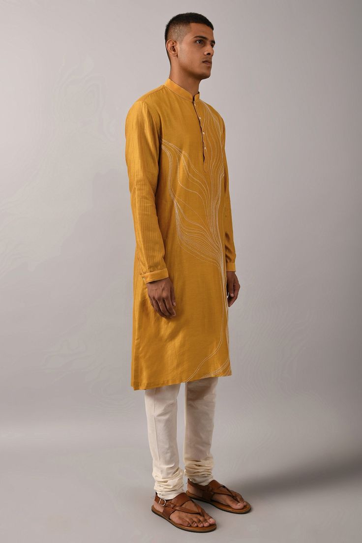 Mustard yellow straight kurta with placement thread work in abstract pattern. Comes with ivory cotton churidar.
Components:2
Embroidered
Neckline:Mandarin Collar
Sleeve Length:Full
Fabric:Chanderi, Cotton
Color:Yellow
Buttoned placket
Stitch lines
Side slits
Cuff sleeves
 - Aza Fashions Cotton Kurta Set, Off White Pants, White Pant, Kurta Set For Men, Mens Kurta, Yellow Outfit, Cotton Kurta, Embroidered Neckline, Fashion App