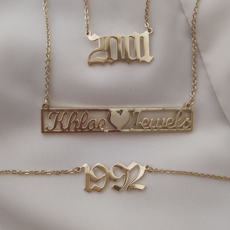 https://khloejewels.com/products/old-english-gothic-birth-year-necklace Metal Charm Necklaces For Mother's Day Anniversary, Metal Charm Necklace For Mother's Day Anniversary, Personalized Metal Nameplate Jewelry, Classic Engraved Jewelry For Birthday, Name Engraved Metal Jewelry For Anniversary, Metal Necklace For Mother's Day Anniversary, Anniversary Metal Jewelry With Name Detail, Anniversary Metal Jewelry With Name, Anniversary Metal Name Jewelry