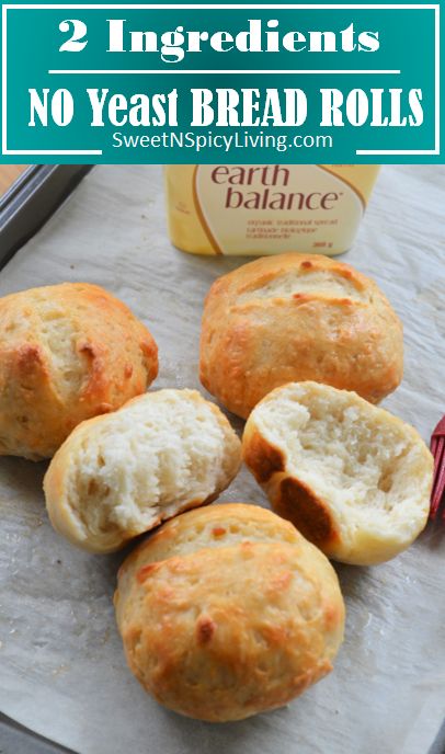 some bread rolls sitting on top of a baking sheet with the words, 2 ingredients no yeast bread rolls