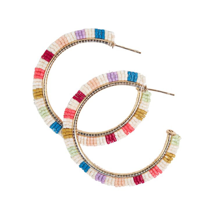 We're convinced that hoop earrings have superpowers. Add lightweight Luxe glass beads and a statement rainbow stripe pattern and you'll be running the world in no time. Style tip: Team member Kendra is the queen of hoops. Her motto is 'When in Doubt, Hoop it out'. Wedding guest? Hoops. Sales meeting? Hoops. Concert? Hoops. Brunch with friends? HOOPS! 2" L x .07" W Handmade by skilled artisans in India Hypoallergenic nickel + lead-free brass hardware These accessories are made by human hands. A s Luxe Boho, Human Hand, Beaded Hoop Earrings, Beaded Hoops, Modern Bohemian, Beads And Wire, Seed Bead Jewelry, Cream And Gold, Rainbow Stripes