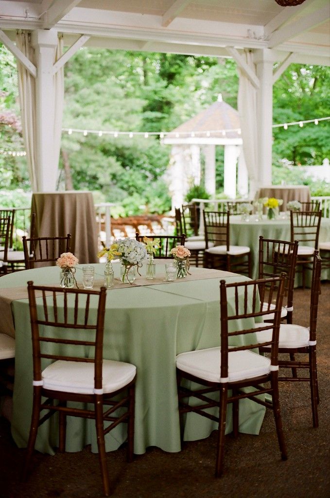 the tables are set up for an outdoor wedding reception