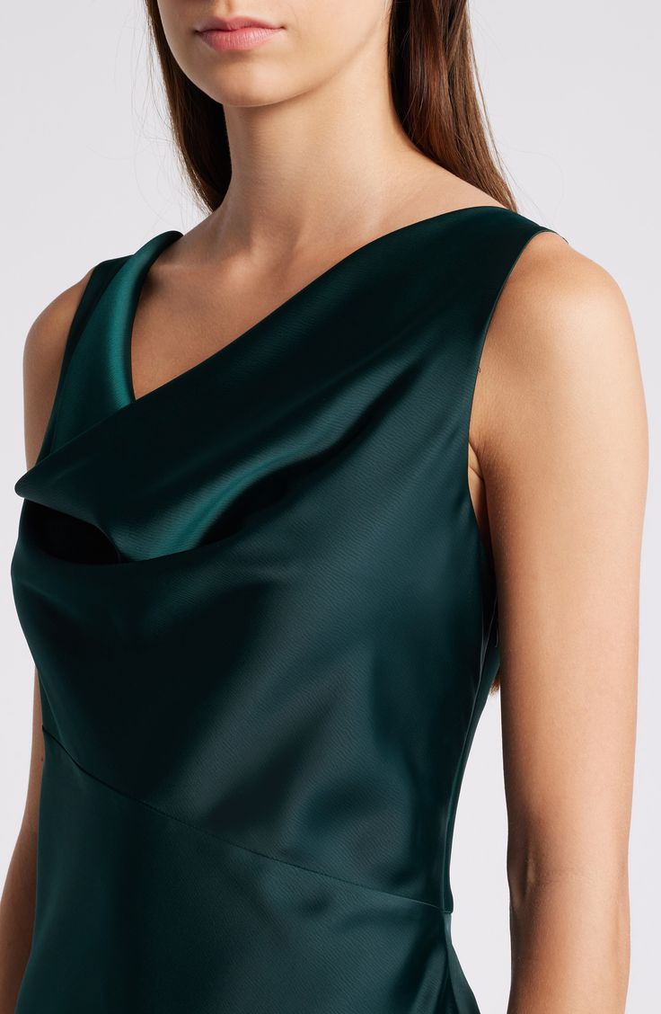 Glossy green satin starts the style story for a bias-cut gown designed with a draped neckline. 60" length (size Medium) Cowl neck Sleeveless 97% polyester, 3% spandex Dry clean Imported Green Cowl Back Dress For Party, Green Cowl Back Party Dress, Green Cowl Back Dress, Pre-draped Sleeveless Green Evening Dress, Green Sleeveless Satin Dress For Formal Occasions, Fitted Green Satin Dress Bias Cut, Green Satin Bias-cut Evening Dress, Green Satin Dress For Evening With Bias Cut, Green Satin Bias Cut Evening Dress