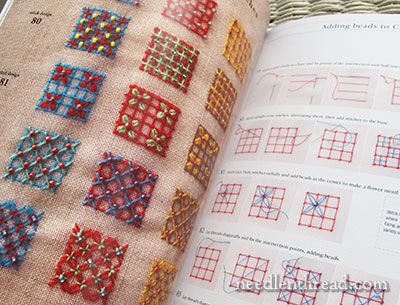 the book is open to show an image of different patterns on fabric and stitching