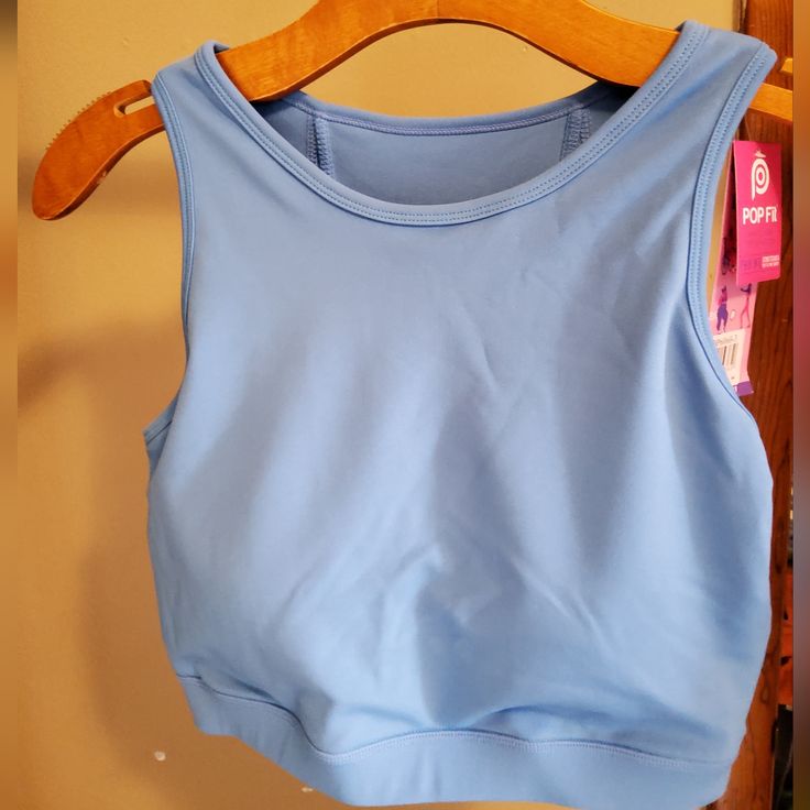 Crop Tank With Padded Bra Blue Athleisure Crop Top For Summer, Trendy Blue Sports Crop Top, Trendy Blue Crop Top For Workout, Blue Athleisure Tops For Spring, Light Blue Stretch Casual Tank Top, Casual Light Blue Stretch Tank Top, Blue Sports Crop Top For Spring, Blue Workout Tops For Spring, Blue Crop Top For Sports In Spring