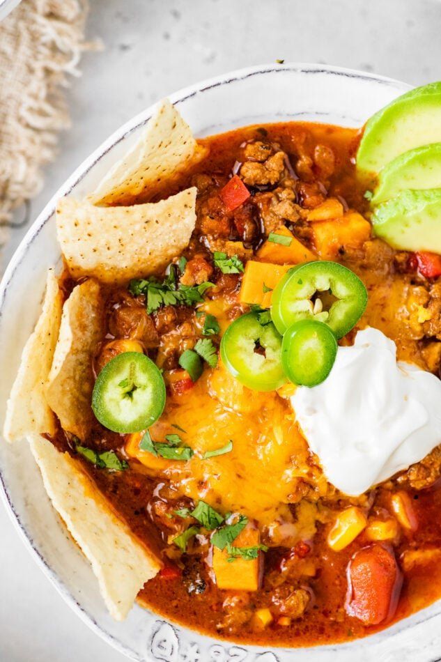 easy and healthy no - bean chili with beef, sweet potatoes, jalapenos, and sour cream