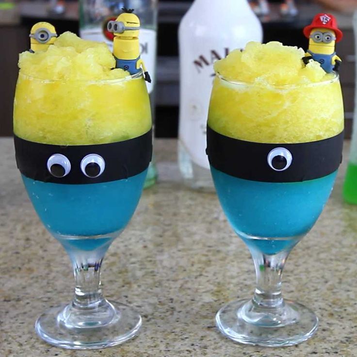 two glasses filled with yellow and blue liquid