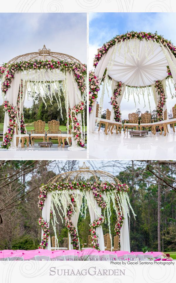 an outdoor wedding set up with white and pink flowers