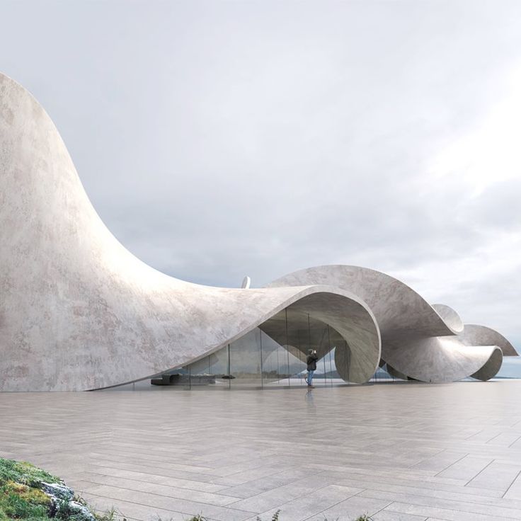 an artisticly designed concrete structure sits on the ground