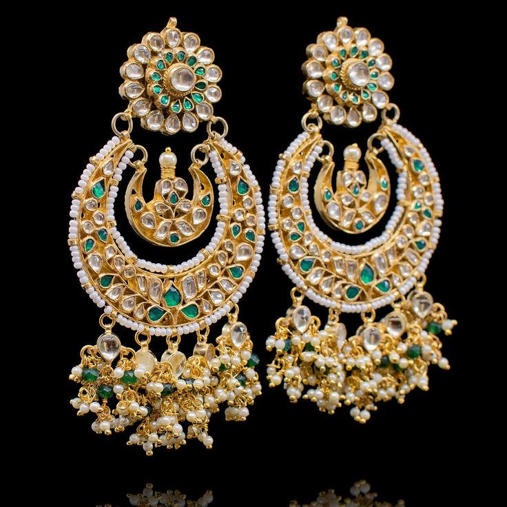 This stunning design is sure to spice up your festive look! The look includes earrings, teekah and jhoomar. Transform any attire in this earrings, maang teekah and headpiece set featuring intricate pearl moti work and accented with kundan stones. Approximate earrings length is 4". Gold-plated on high-quality brass as base metal. Made by order. Kindly allow 4-6 weeks for the delivery of this item. For custom or urgent requests, please contact support@alacouture.com. *Please Note: We use faux ston Festive Chandbalis With Gota Work For Reception, Festive Gota Work Chandbalis For Reception, Bollywood Kundan Danglers For Reception, Kundan Meenakari Chandbalis For Reception, Bollywood Style Kundan Danglers For Reception, Reception Chandbali Chandelier Earrings In Kundan, Diwali Reception Chandbalis With Gota Work, Kundan Jhumkas For Eid Reception, Kundan Chandbalis With Stone Work For Reception