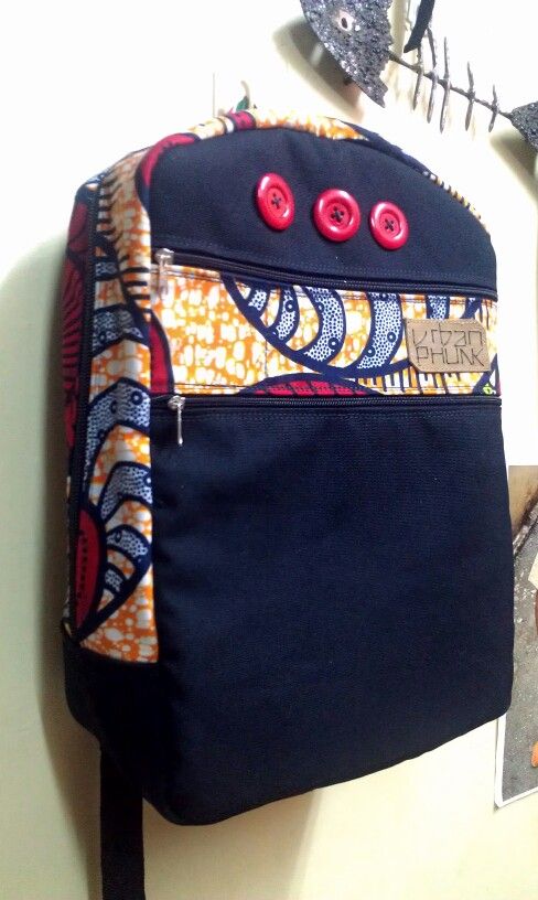 Urbanphunk canvas laptop bag with button & ankara details Kanga Fabric, Ankara Backpack, Canvas Laptop Bag, Kitenge Designs, Leather Inspiration, Bag Packs, Ankara Bags, Fabric Products, Handmade Fabric Bags