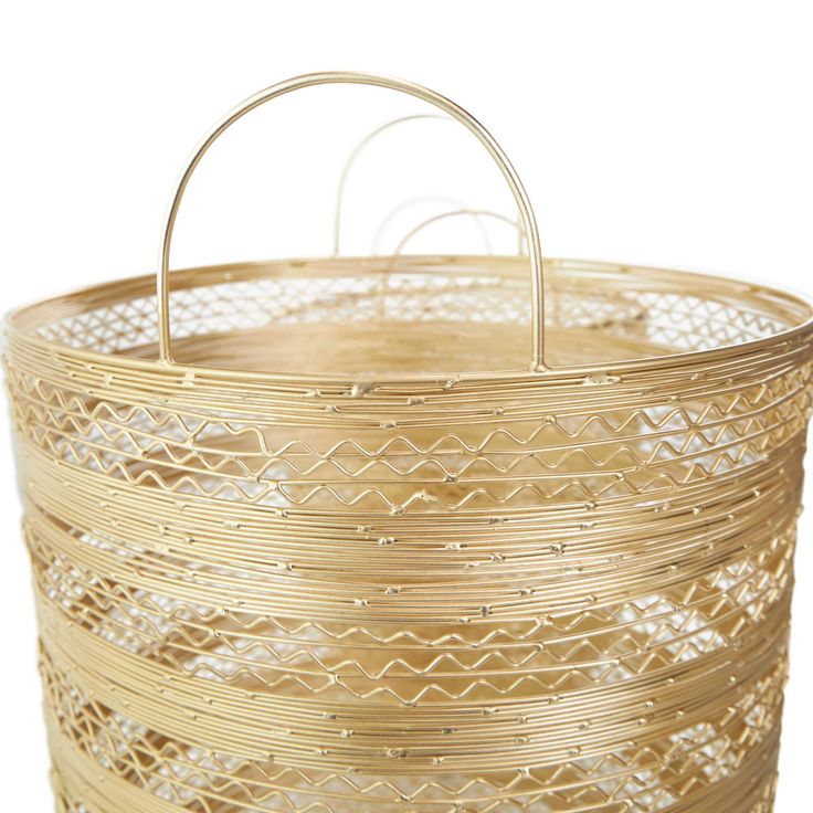 a round basket with metal handles on a white background