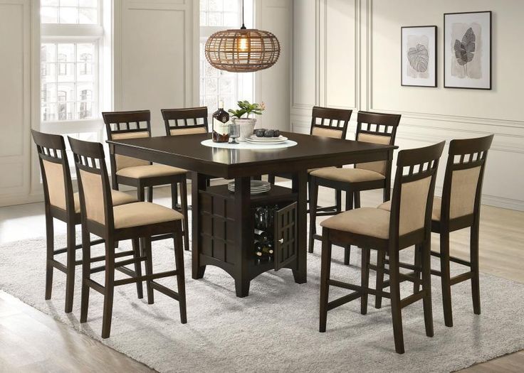 a dining room table with chairs around it