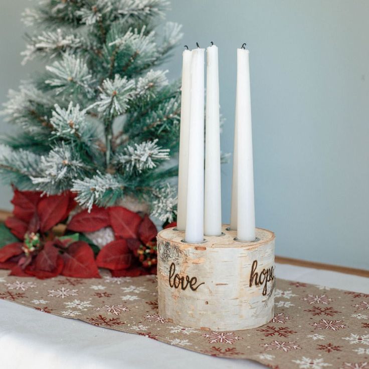 This unique advent wreath is the perfect centerpiece for your holiday table. Made with an all-natural white birch log, drilled to hold 5 advent taper candles and hand-burned around the outside with the 4 Advent words, Hope, Peace, Joy & Love. This one-of-a-kind advent wreath is made from sustainably sourced birch wood from Northern Maine and will last a lifetime to be enjoyed by generations to come! INCLUDES: One log that is 4-5" in diameter and 3-4" tall and drilled to fit the included 5 - 10" Advent Colors, Birch Tree Decor, 4 Advent, Northern Maine, Birch Logs, Hand Burn, Advent Wreath, White Birch, Birch Tree