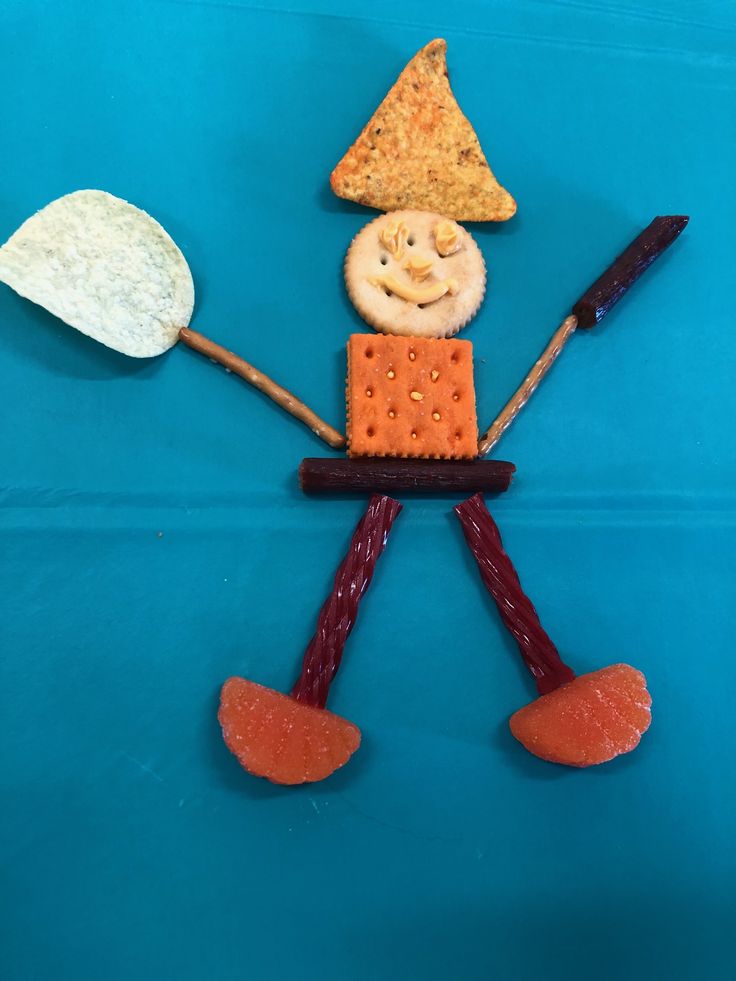 a piece of art made to look like a man with food on his face and legs