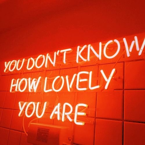 a neon sign that says you don't know how lovely you are on the wall