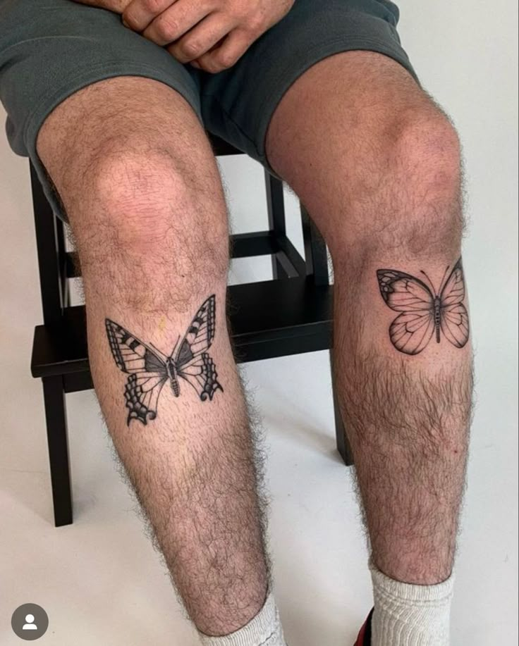 a man with a butterfly tattoo on his leg