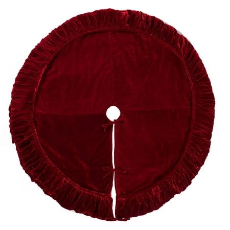 a red round cushion with ruffles on the bottom and white button at the center