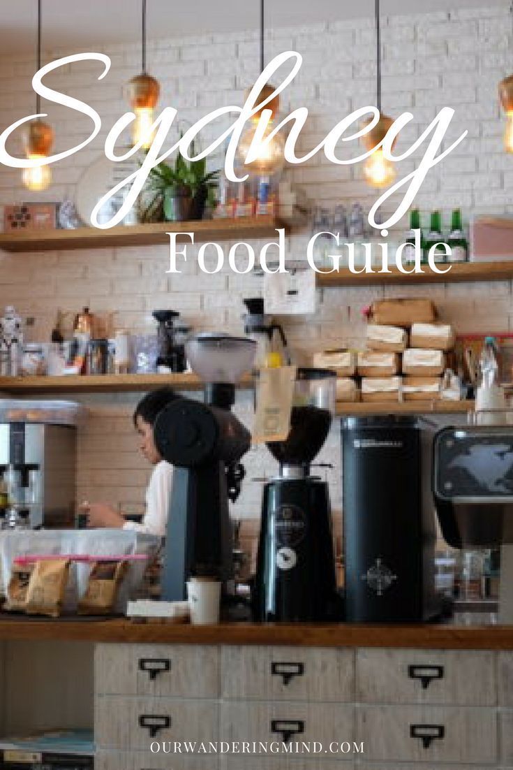 a coffee shop with the words sydney food guide on it's wall and shelves