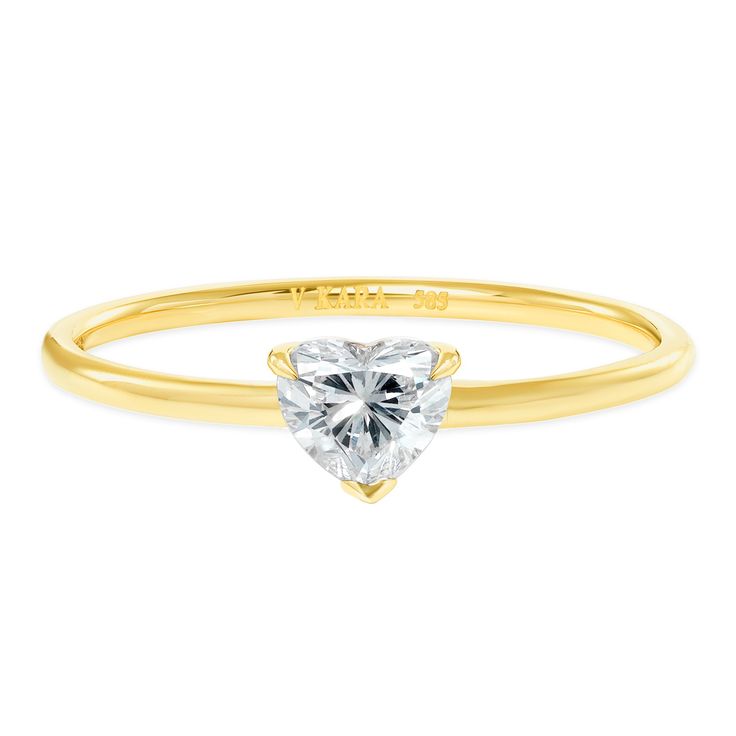 a yellow gold ring with a heart shaped diamond