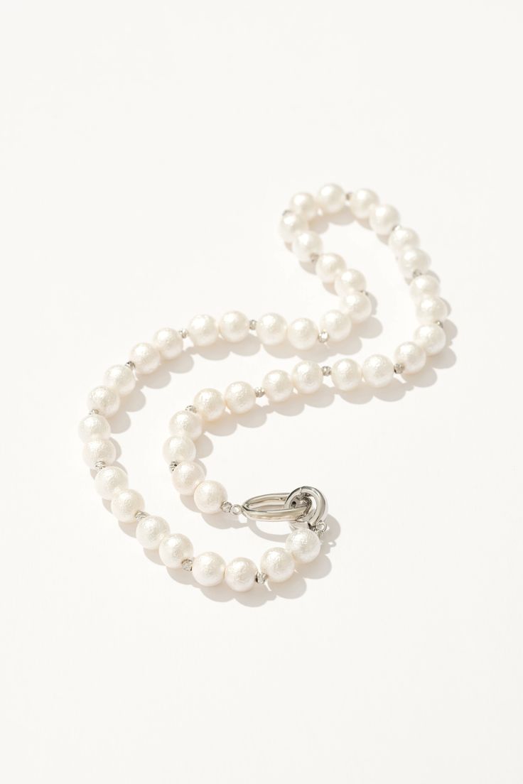 Timeless beauty that whispers sophistication and grace. Glamorous Pearl Charm Jewelry Gift, Glamorous Pearl Charm Jewelry For Gifts, Glamorous Jewelry With Pearl Charm For Gift, Elegant Silver Pearl Necklace With Sterling Silver Clasp, Glamorous Silver Pearl Necklace For Formal Occasions, Pearl White Necklace For Evening, Pearl White Jewelry With Lobster Clasp, Glamorous Silver Jewelry With Pearl Charm, Glamorous Silver Pearl Necklace Gift