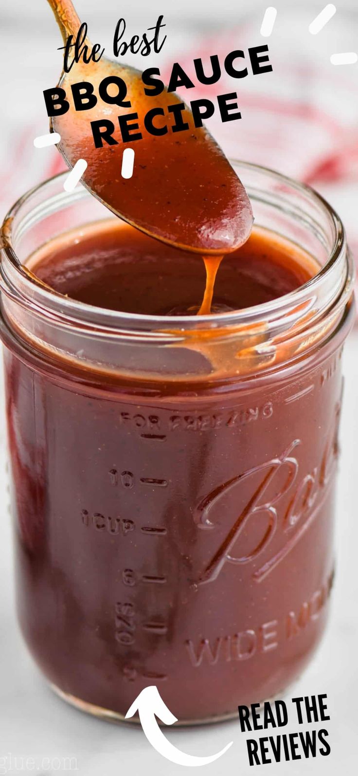 the best bbq sauce recipe is in a jar with a spoon full of barbecue sauce