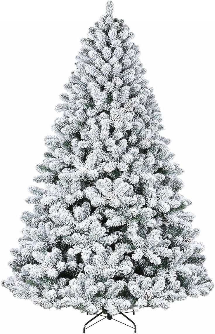 a white christmas tree with snow on it