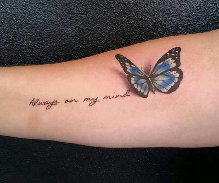 a blue butterfly with the words always on my arm