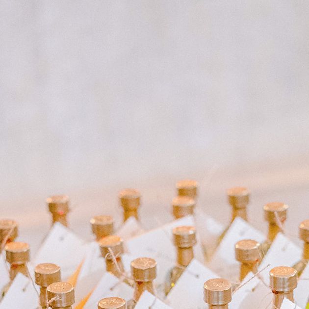 several small bottles are lined up on the table