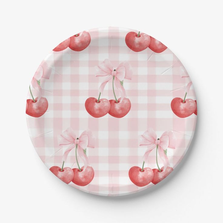 a plate with cherries and bow on the front, in pink gingham