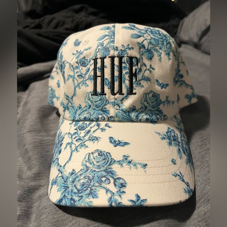 Huf Brand Baseball Cap. Adjustable Back. Cute White And Blue Antique Flower Pattern. Only Tried On Never Worn. Kept In Smoke/Animal Free Home. Blue Curved Brim Dad Hat For Spring, Blue Baseball Cap With Curved Visor For Spring, Spring Blue Dad Hat With Curved Bill, Blue Curved Visor Dad Hat For Summer, Blue Dad Hat For Summer Streetwear, Blue Summer Dad Hat With Curved Visor, Casual Floral Print Cap, Casual Cotton Hats With Floral Print, Casual Hat With Curved Brim And Floral Print