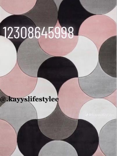 an area rug with circles on it in grey, pink and black colors is shown