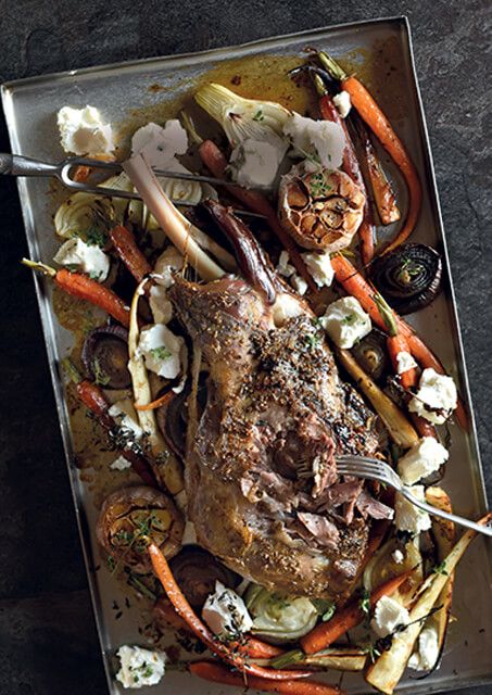 a roasting pan filled with meat and vegetables