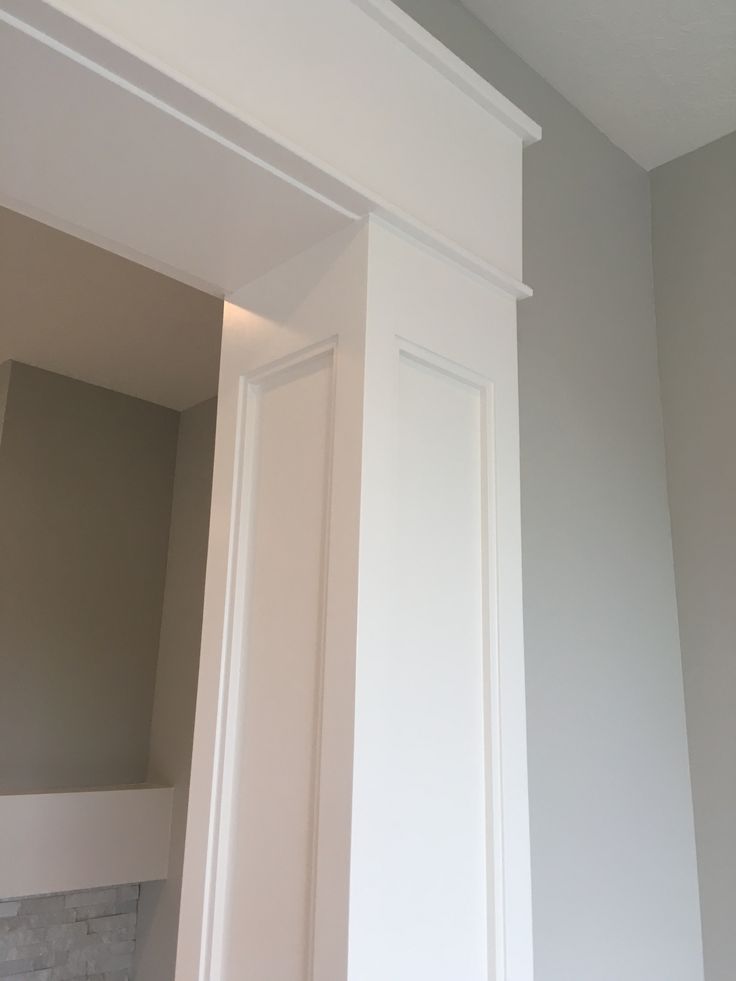 the corner of an empty room with white trim