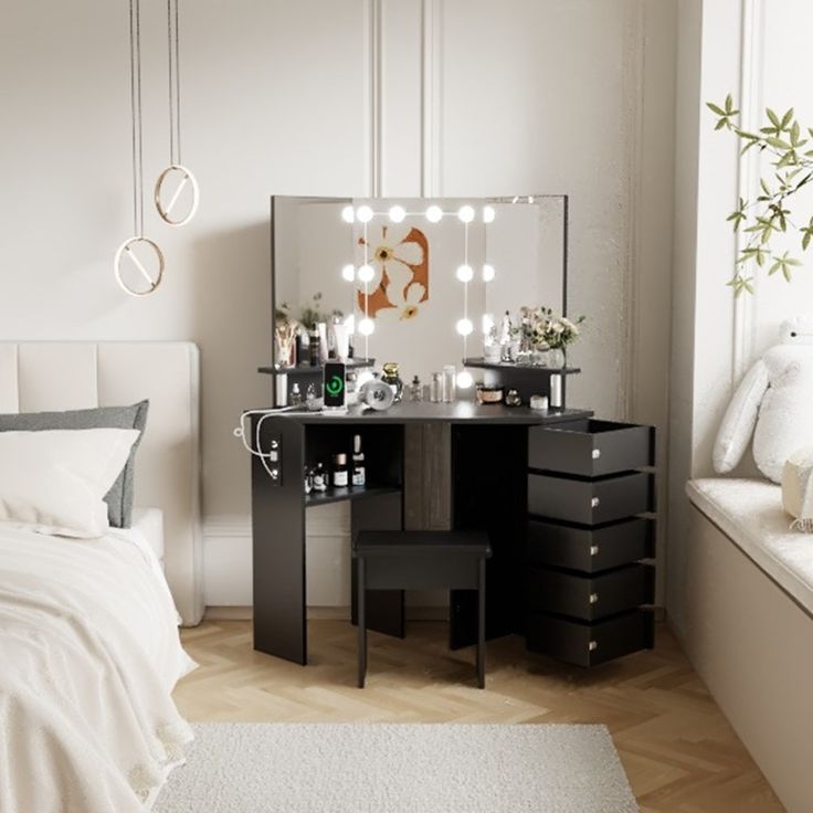 a bedroom with a bed, mirror and lights on the side table in front of it