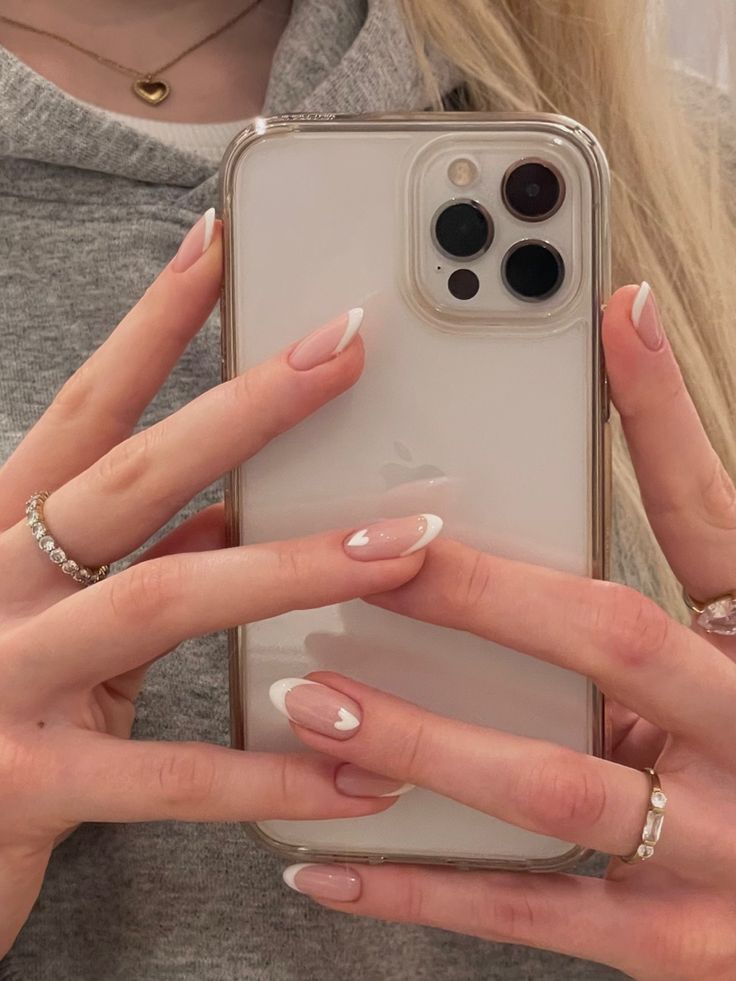 Pastel Hearts Nails, White Hoco Nails Almond, White French Tip Nails With Line, French Nails With White Heart, Short Acrylic Nails Square French White Manicure Art Designs, French Smile Line Nails, Soft White French Tip Nails, White French Tips With Heart, White Hearts Nails