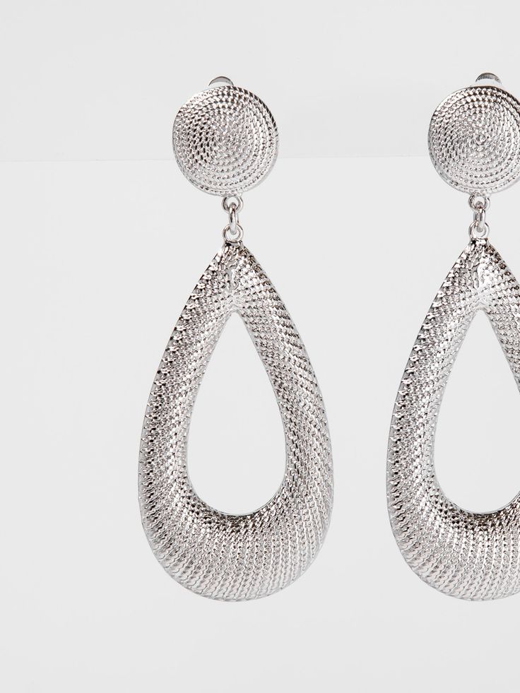 Introducing the Emerson Teardrop Metal Clip-On Earrings - the perfect accessory for those with non-pierced ears. These elegant and stylish earrings feature a teardrop design made of durable metal, with a convenient clip-on closure. Elevate your look with these sophisticated earrings. SizeH: 0.6" W: 0.5" QualityCrafted from premium materials for quality and endurance. ImportedECQM115 Single Metal Teardrop Earring For Party, Clip-on Teardrop Earrings For Party, Formal Metal Teardrop Drop Earrings, Hypoallergenic Metal Teardrop Earrings For Party, Metal Teardrop Pierced Earrings For Party, Pierced Metal Teardrop Earrings For Party, Silver Teardrop Clip-on Earrings, Party Teardrop Pierced Metal Earrings, Silver Metal Teardrop Pendant Drop