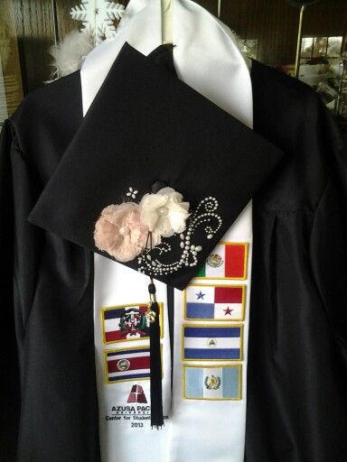 a graduation cap and gown are on display