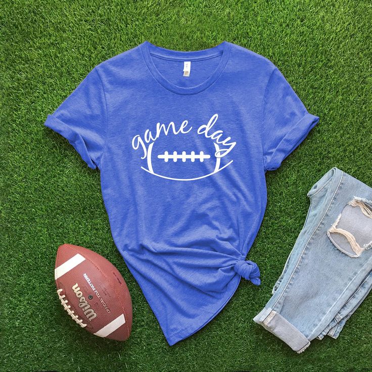 Game Day with football graphic on front of t-shirt. Graphic color varies on t-shirts. Adult Sizes S-XXL (unisex sizing)Youth Sizes S-XL (unisex sizing) For Game Day Sweatshirts click here to view.Bella + Canvas4.2 oz. Airlume combed and ring-spun cottonPre-shrunkFor a more relaxed fit, size up! Game Day T-shirt With Screen Print For Sports Season, Football Season Fan Apparel T-shirt With Screen Print, Screen Print T-shirt For Football Season, Football Season Sports Fan T-shirt With Screen Print, Sports Fan T-shirt For Football Season With Screen Print, Football Season Graphic Tee T-shirt, Graphic Tee T-shirt For Football Season, Pre-shrunk Graphic Tee For Football Season, Blue Graphic Print T-shirt For Football Season