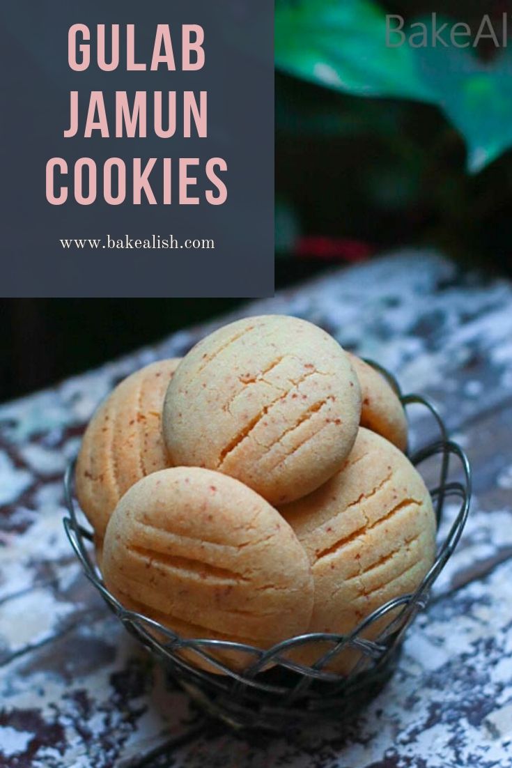 gulab jamun cookies in a wire basket on a table with text overlay