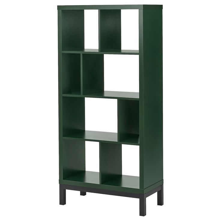 a green bookcase with four shelves on the bottom and one in the middle, against a white background