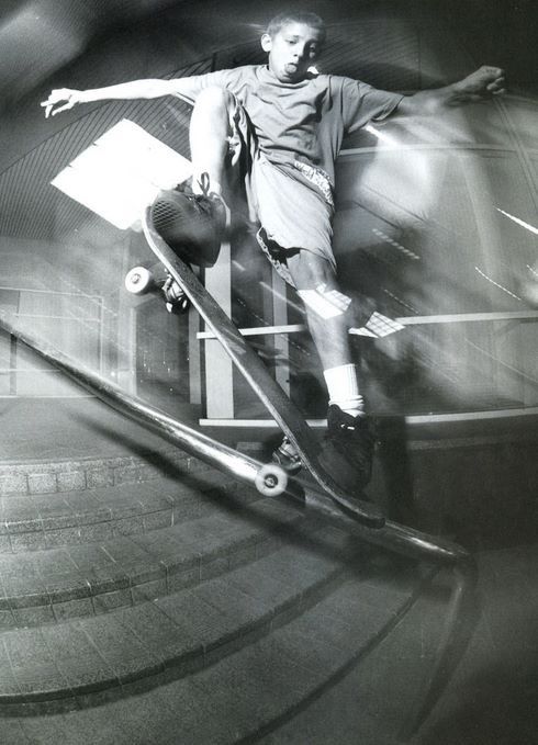 a man riding a skateboard up the side of a ramp