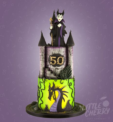 a birthday cake with an image of a witch on top