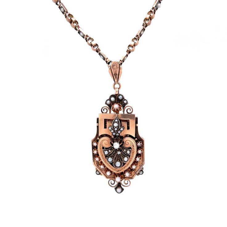 Victorian Rose Gold Pearl Necklace in 14k. This necklace is an eye-catching chandelier for your neckline! Sculpted in 14k rose gold and sterling silver, this glamorous pendant necklace has a heart-shaped design topped with a pearl, fleur-de-lis décor blooming from the center. Created between the 1830s 1900s, this Victorian pendant is sure to dazzle any antique jewelry collector! Victorian Rose Gold Filigree Necklace, Victorian Rose Gold Medallion Necklace, Formal Victorian Rose Gold Necklace, Victorian Rose Gold Pendant Necklace, Rose Gold Pearl Necklace, Romantic Necklace, Victorian Pendants, Rose Gold Pearl, Gold Pearl Necklace