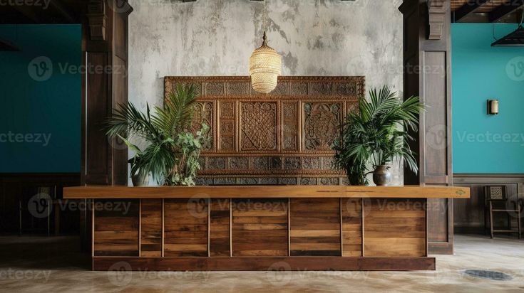 a large wooden table sitting in front of two potted plants